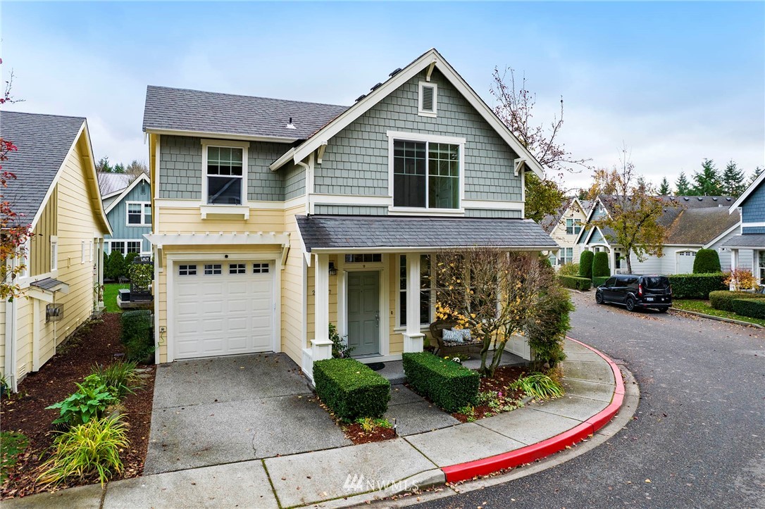 23927 33rd Drive Southeast, Unit 15 Bothell, WA 98021 - Photo 2 of 34 a front view of a house with garden