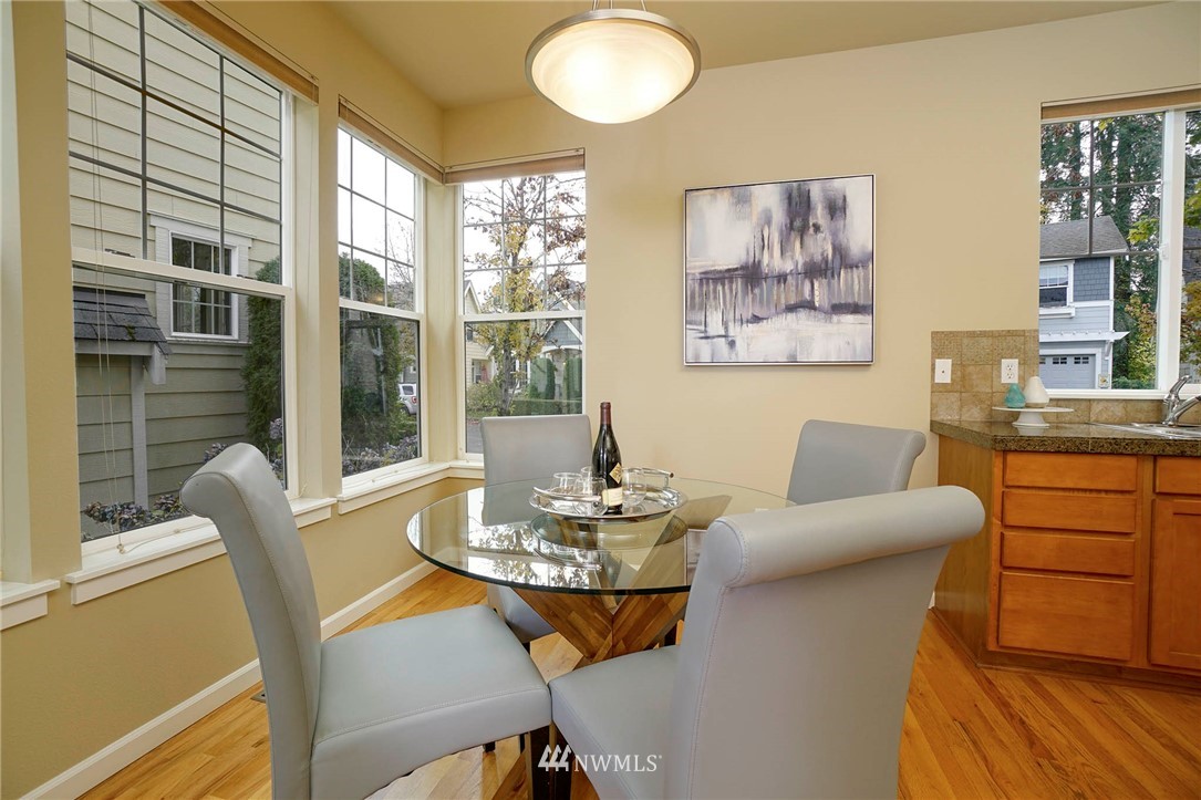 23927 33rd Drive Southeast, Unit 15 Bothell, WA 98021 - Photo 14 of 34 a dining room with furniture and wooden floor