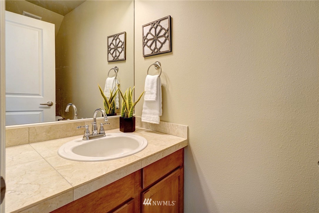 23927 33rd Drive Southeast, Unit 15 Bothell, WA 98021 - Photo 15 of 34 a bathroom with a sink and a mirror