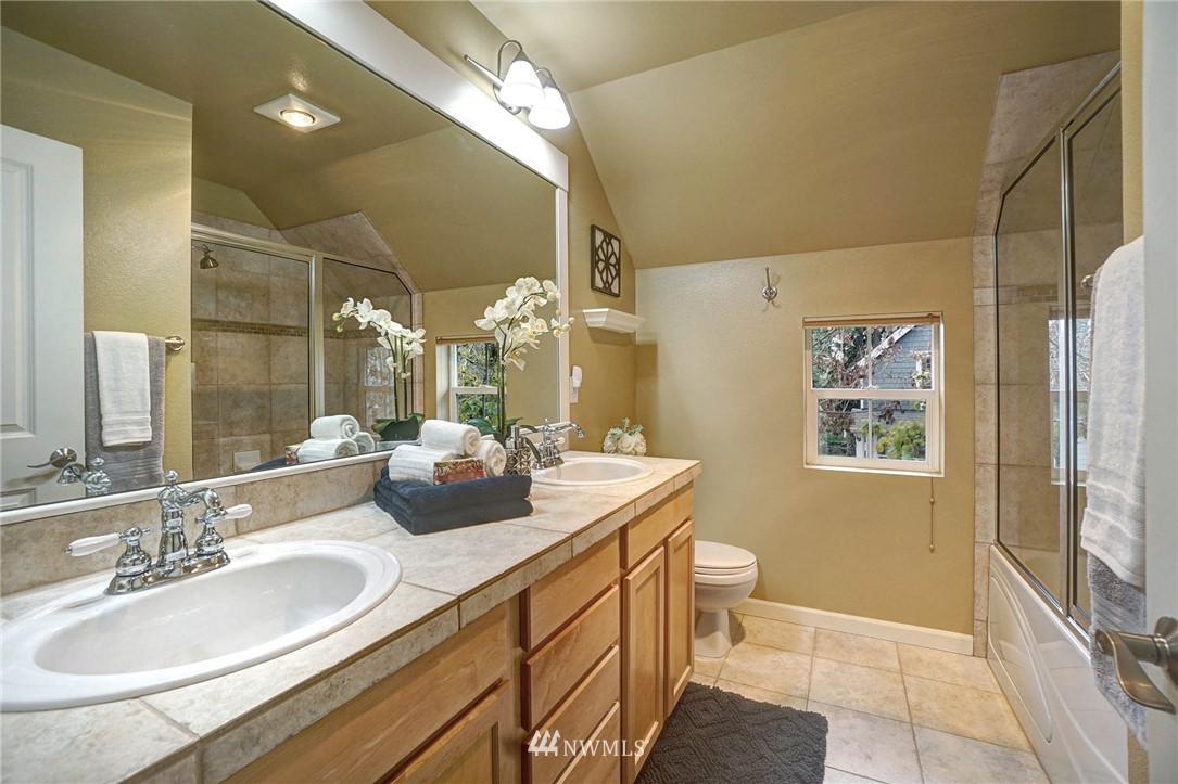 23927 33rd Drive Southeast, Unit 15 Bothell, WA 98021 - Photo 20 of 34 a bathroom with a double vanity sink mirror and toilet