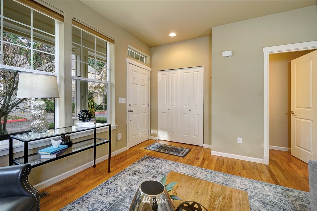 23927 33rd Drive Southeast, Unit 15 Bothell, WA 98021 - Photo 6 of 34 a spacious bedroom with a bed and wooden floor