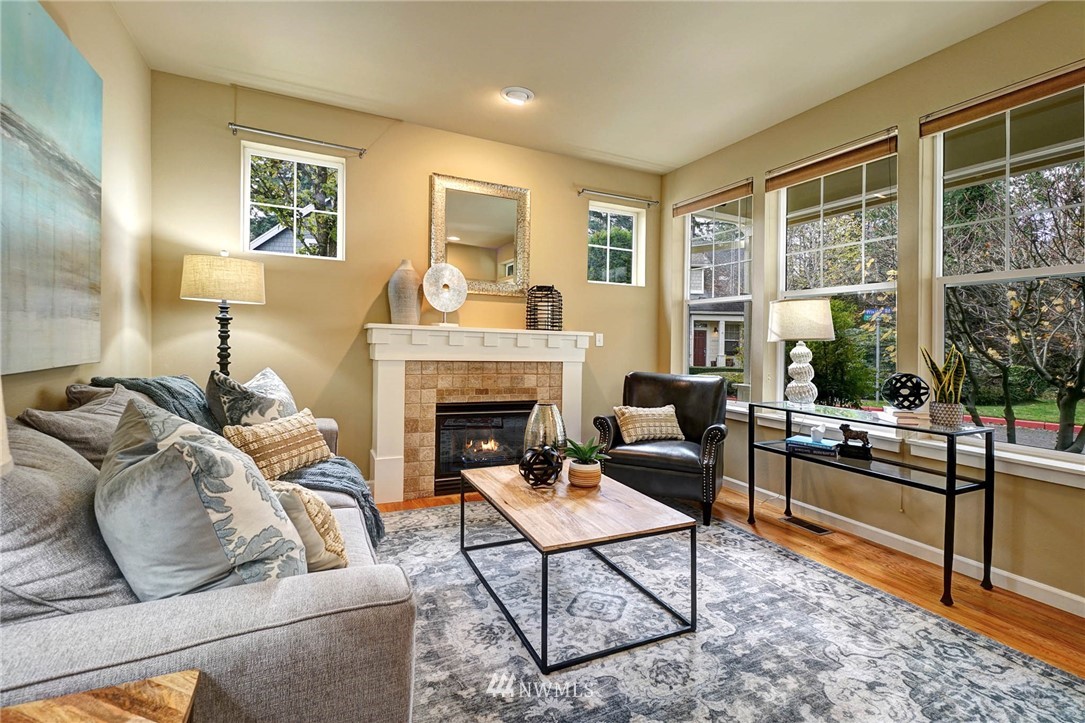 23927 33rd Drive Southeast, Unit 15 Bothell, WA 98021 - Photo 7 of 34 a living room with furniture fireplace and a large window
