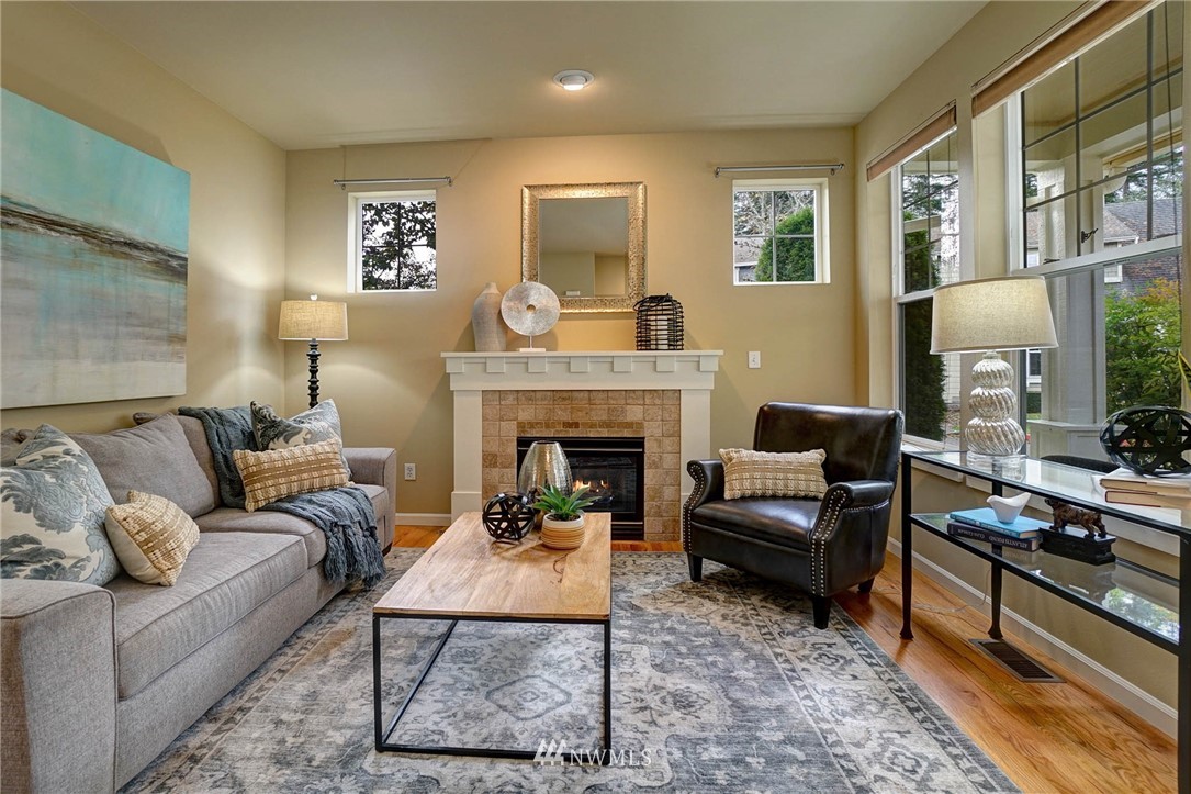 23927 33rd Drive Southeast, Unit 15 Bothell, WA 98021 - Photo 8 of 34 a living room with furniture and a fireplace