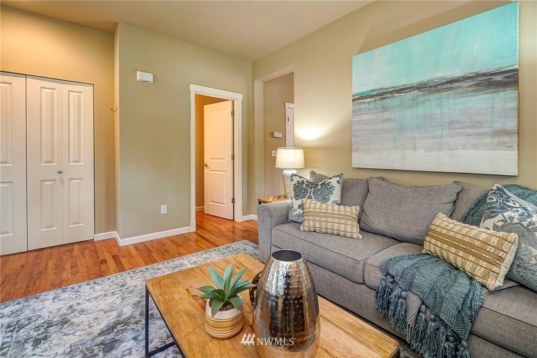 23927 33rd Drive Southeast, Unit 15 Bothell, WA 98021 - Photo 9 of 34 a living room with furniture and a couch