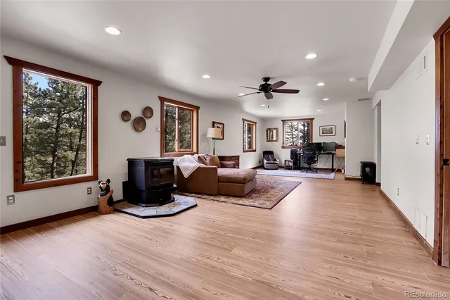 a living room with furniture window and wooden floor