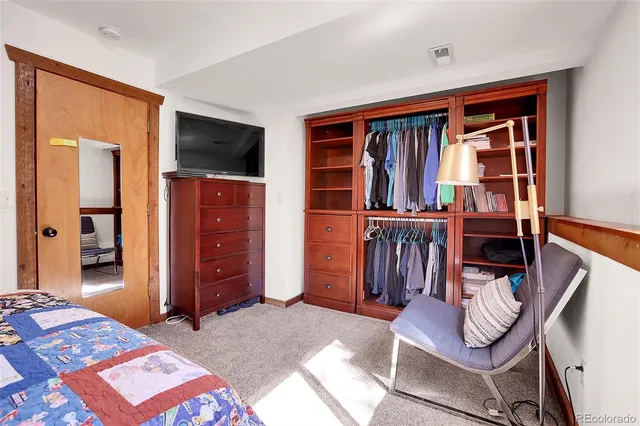 a bedroom with a bed and furniture