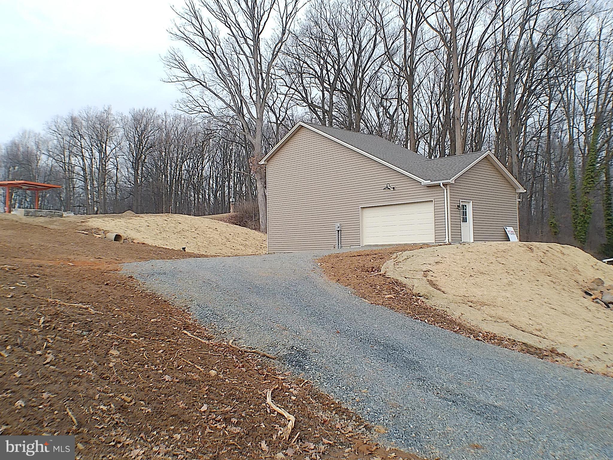 1735 Quarry Road Lebanon, PA 17046 - Photo 23 of 24 a white house with a large tree in front of it