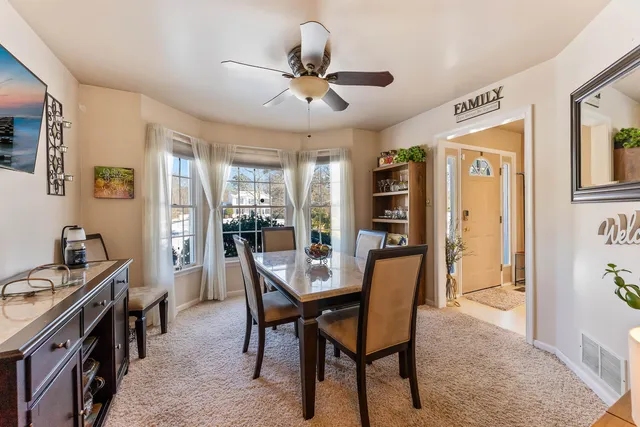 a view of a dining room with furniture window and outside view