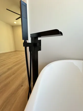 a white bath tub sitting in a bathroom