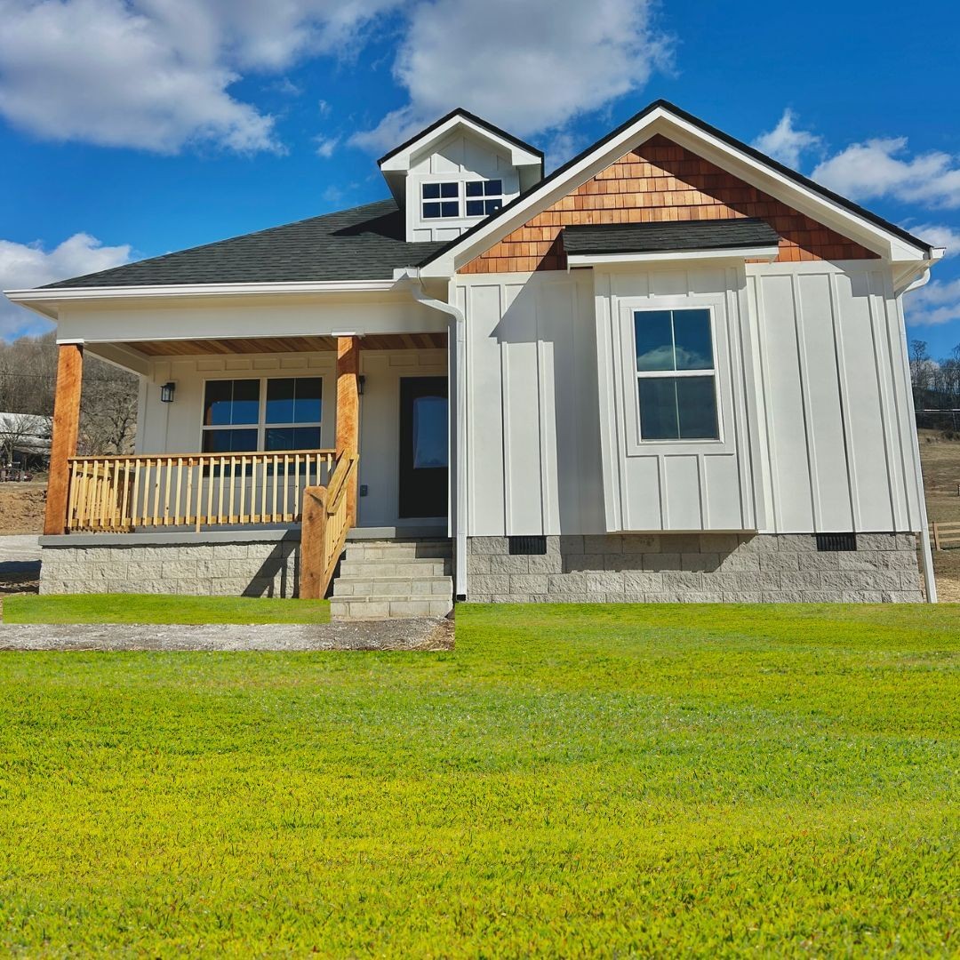 9728 Campbellsville Road Pulaski, TN 38478 - Photo 2 of 21 a front view of a house with a garden