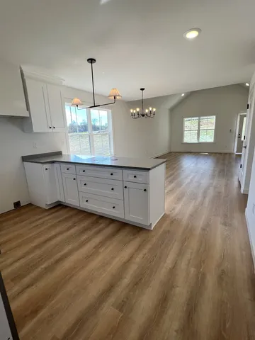a view of a livingroom with wooden floor