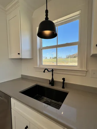 a kitchen with a sink and a window