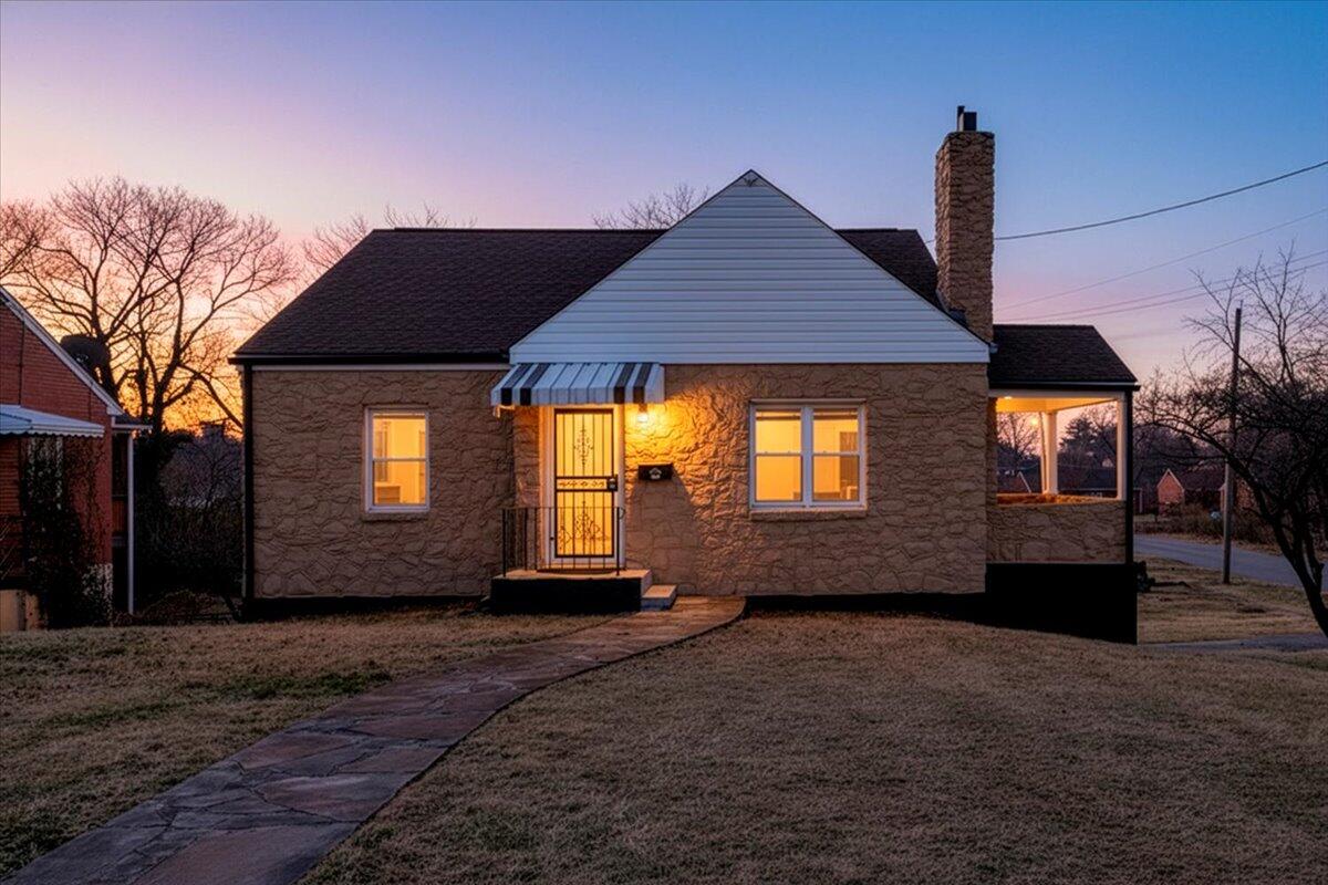 3452 Courtland Road Northwest Roanoke, VA 24012 - Photo 1 of 54 a front view of a house with a yard