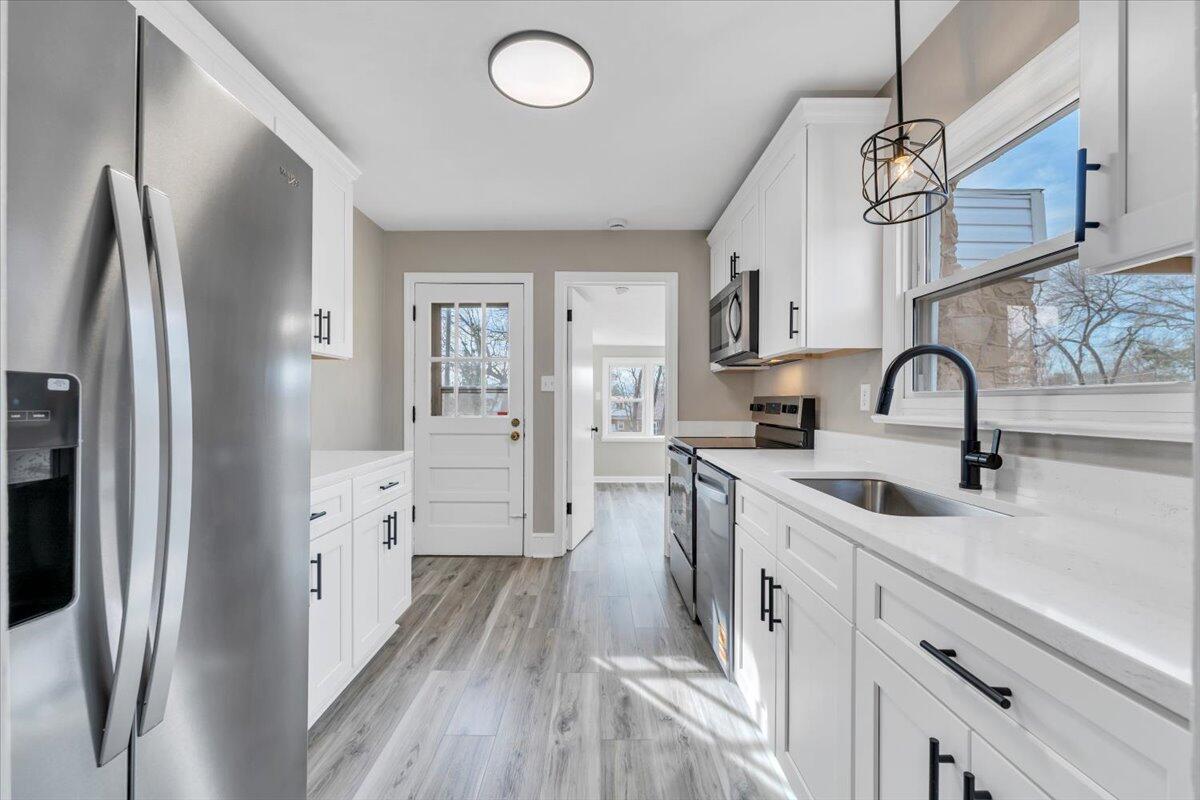 3452 Courtland Road Northwest Roanoke, VA 24012 - Photo 11 of 54 a kitchen with cabinets and stainless steel appliances