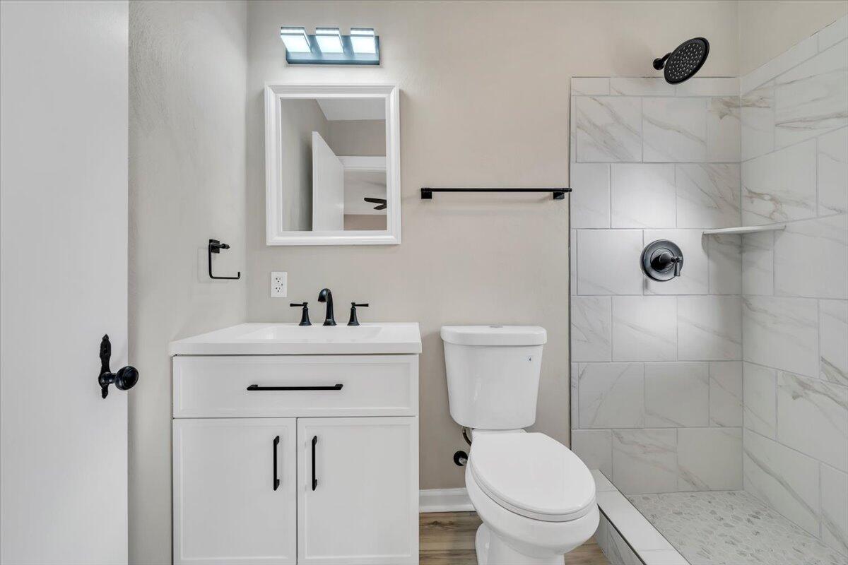 3452 Courtland Road Northwest Roanoke, VA 24012 - Photo 22 of 54 a bathroom with a sink a toilet and shower
