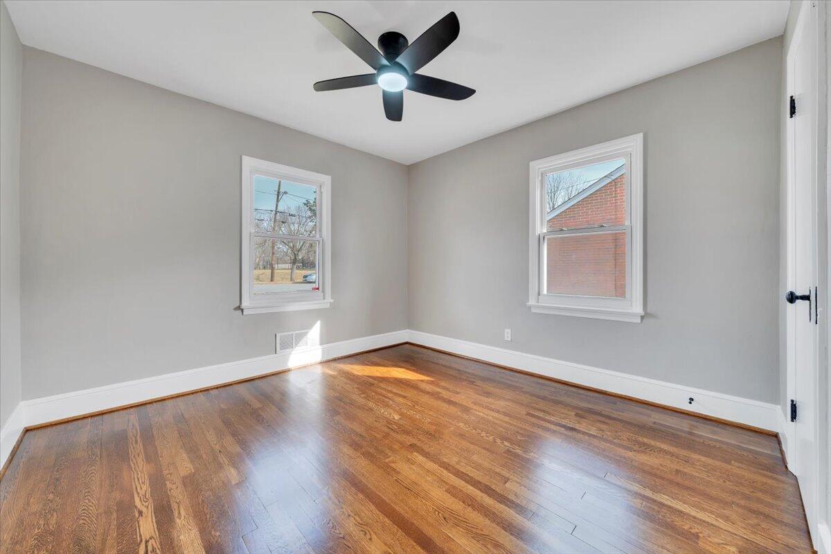 3452 Courtland Road Northwest Roanoke, VA 24012 - Photo 26 of 54 a view of empty room with wooden floor and fan