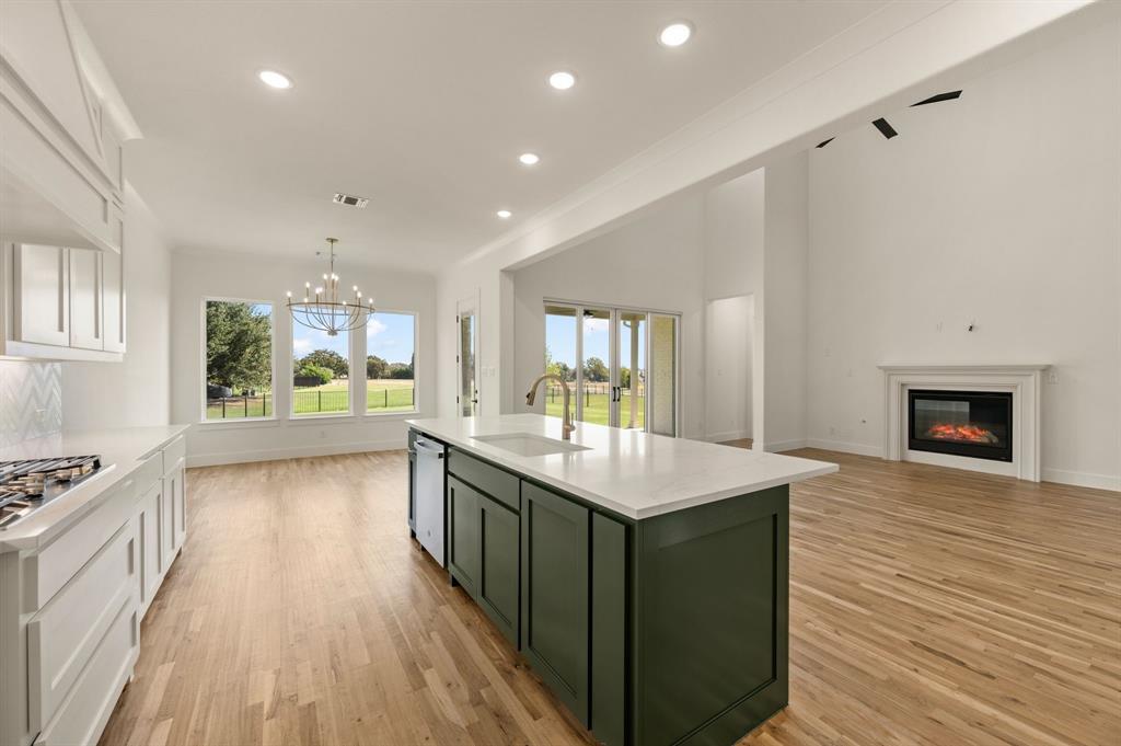 128 Highgate Court Boyd, TX 76023 - Photo 13 of 40 a kitchen with a sink and stove top oven