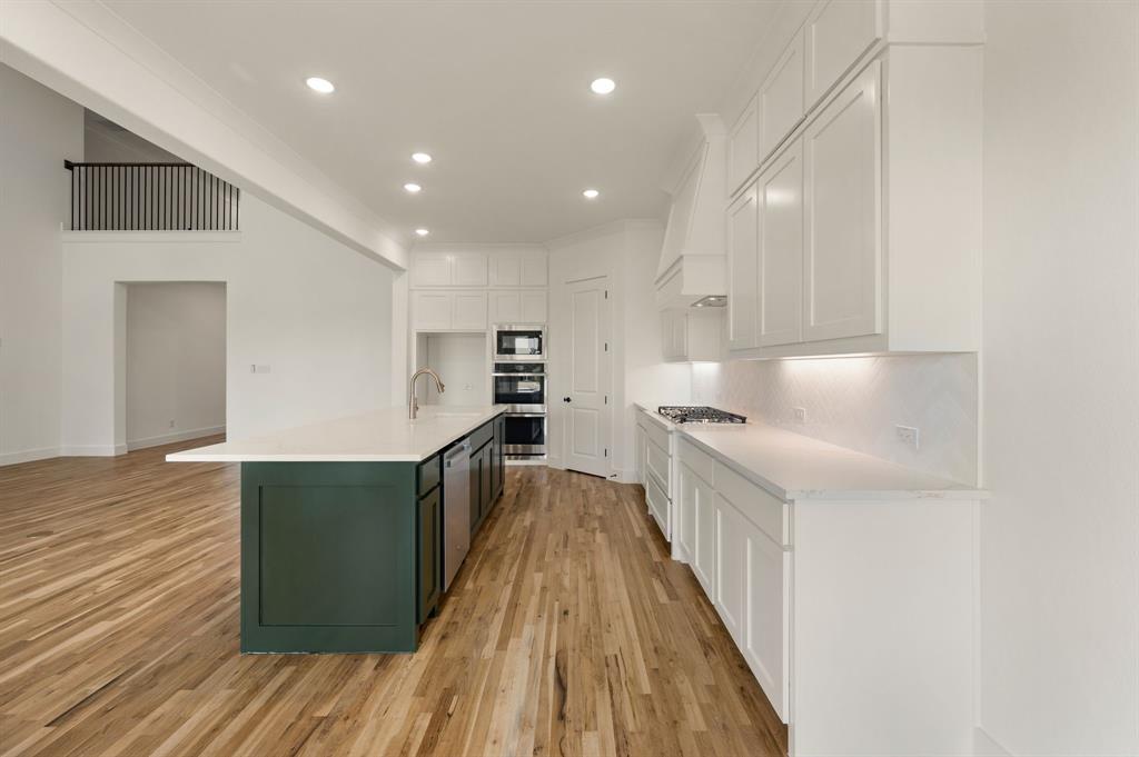 128 Highgate Court Boyd, TX 76023 - Photo 15 of 40 a view of kitchen with wooden floor