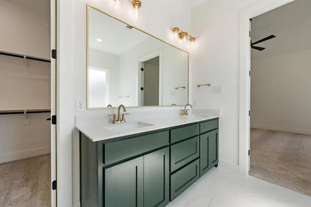 a bathroom with a sink double vanity and a mirror