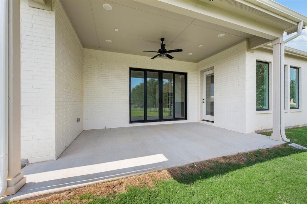 128 Highgate Court Boyd, TX 76023 - Photo 34 of 40 a view of an empty room with a fireplace and a window