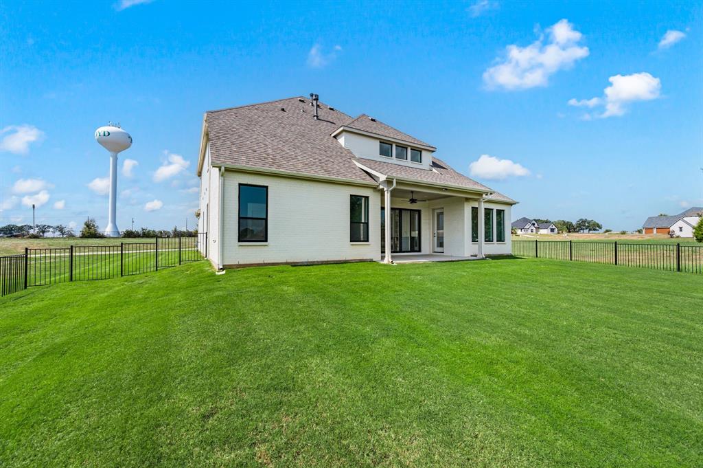 128 Highgate Court Boyd, TX 76023 - Photo 37 of 40 a view of a house with a backyard
