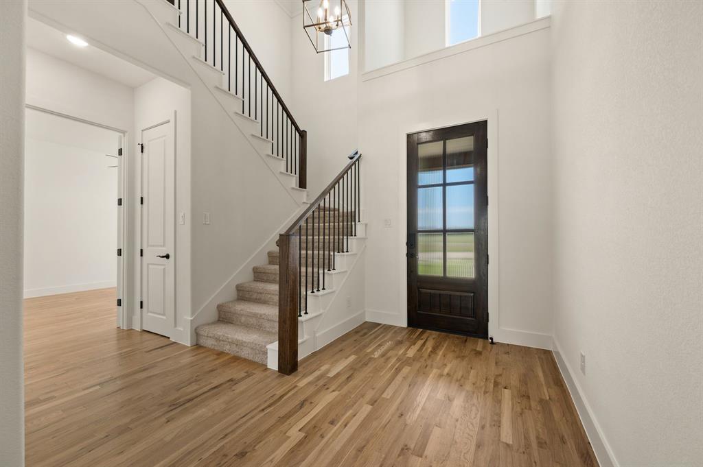 128 Highgate Court Boyd, TX 76023 - Photo 5 of 40 a view of entryway and hall with wooden floor