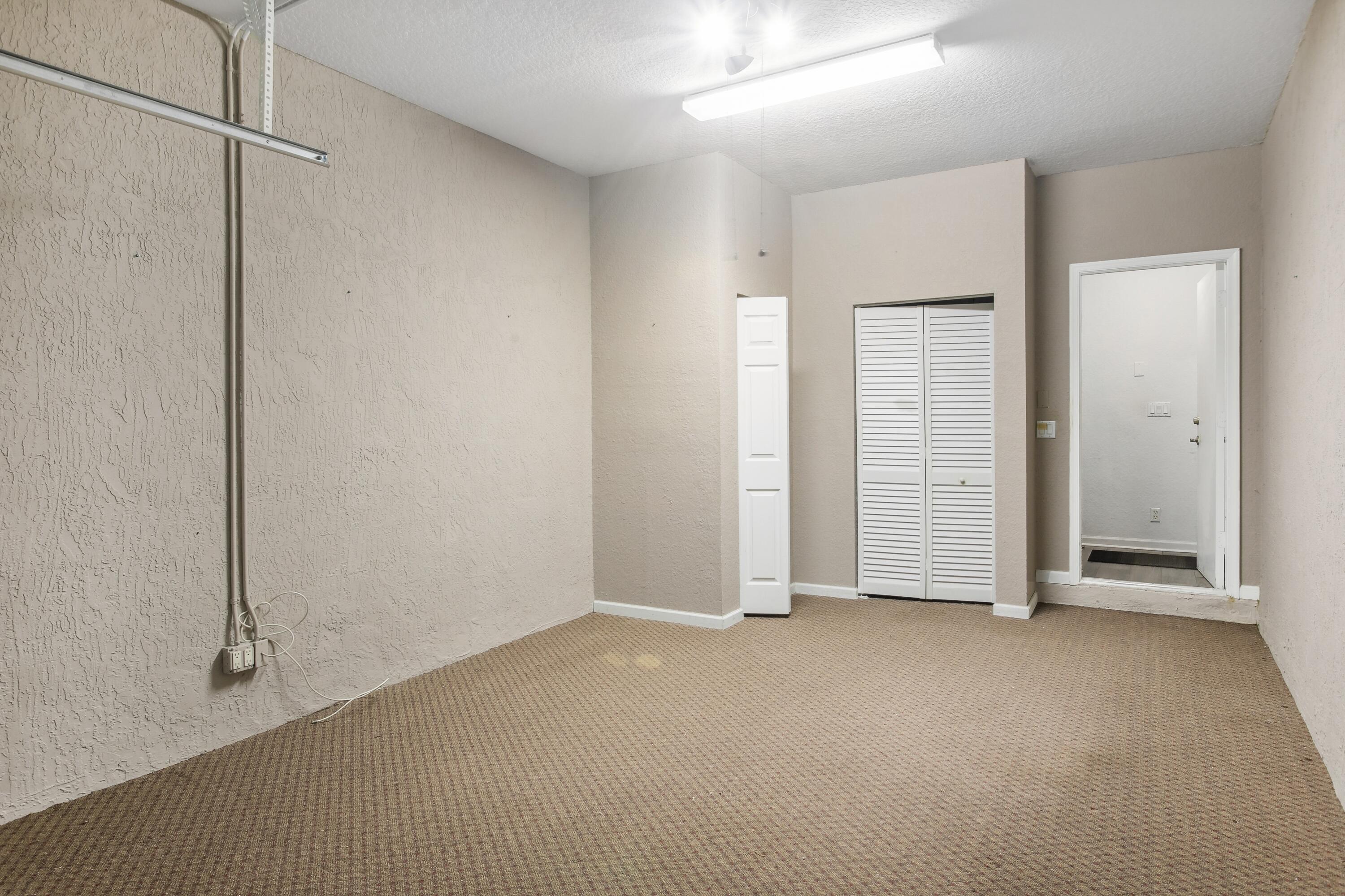 3248 Mirella Drive Riviera Beach, FL 33404 - Photo 9 of 25 Garage with Storage