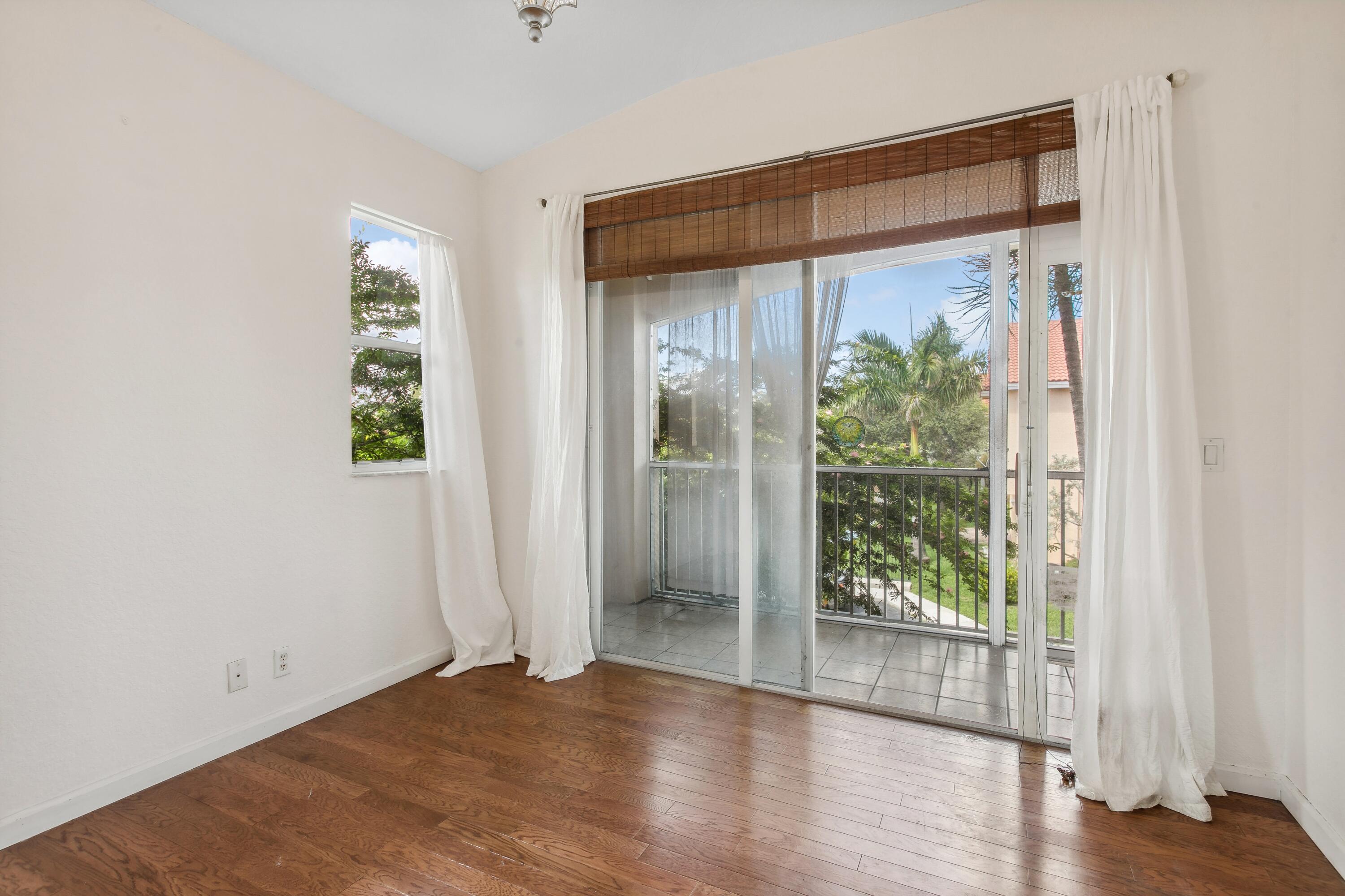 3248 Mirella Drive Riviera Beach, FL 33404 - Photo 11 of 25 Master Bedroom Suite w Balcony
