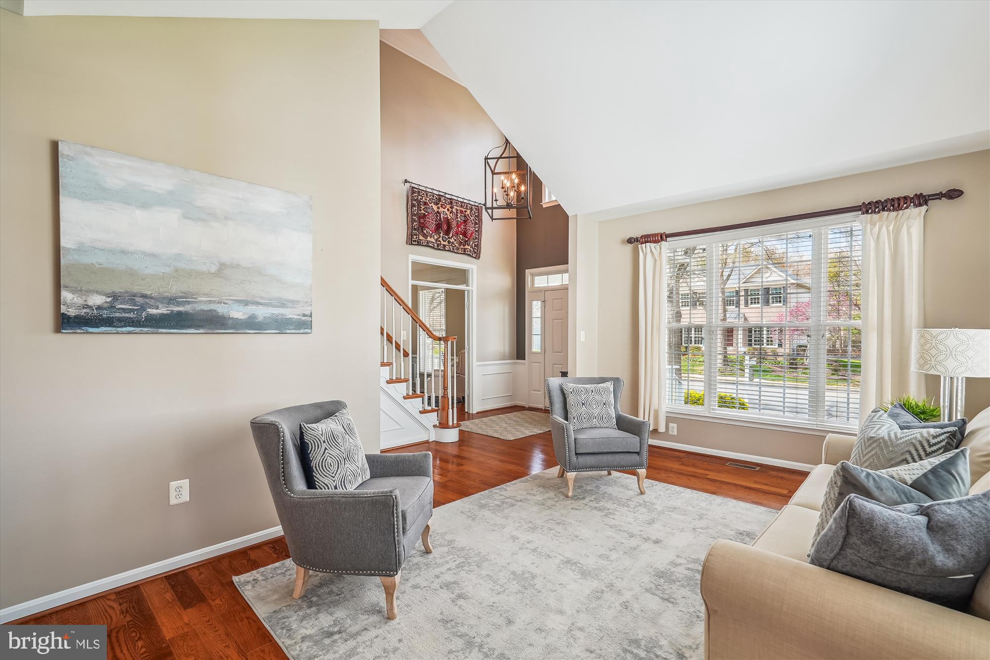 42925 Ellzey Drive Broadlands, VA 20148 - Photo 20 of 96 a living room with furniture and a large window