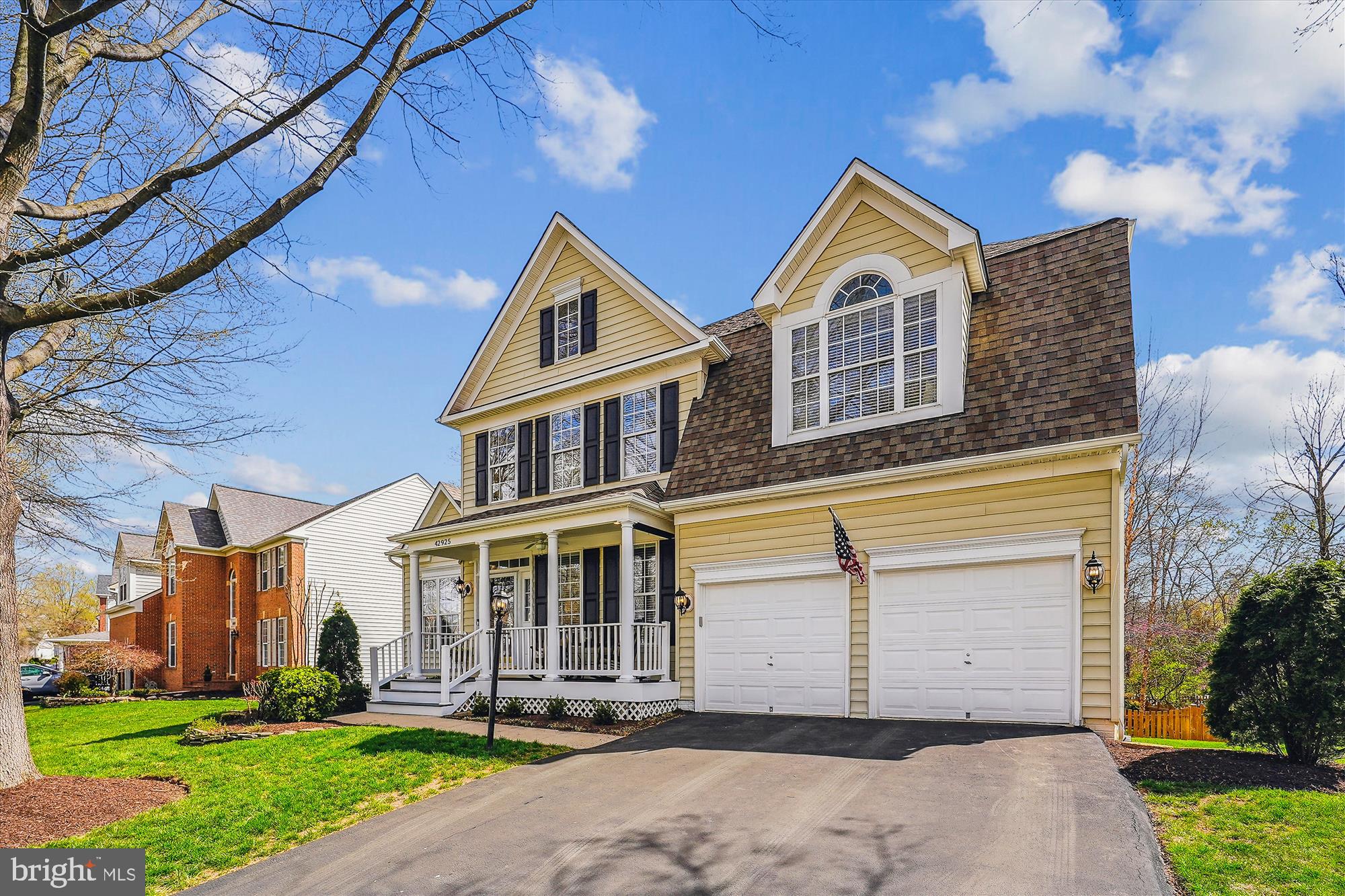 42925 Ellzey Drive Broadlands, VA 20148 - Photo 2 of 96 a front view of a house with a yard