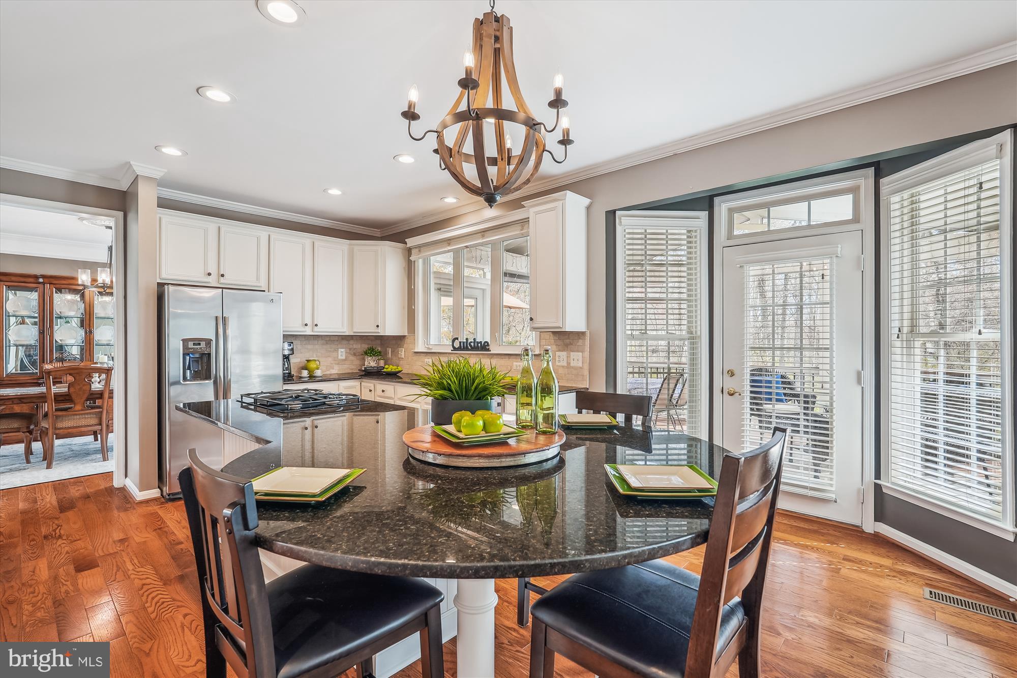 42925 Ellzey Drive Broadlands, VA 20148 - Photo 27 of 96 a view of a dining room with furniture a chandelier and wooden floor