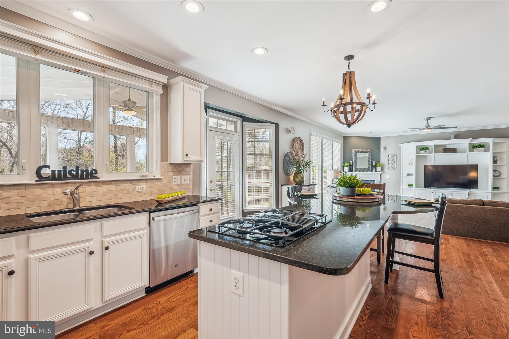 42925 Ellzey Drive Broadlands, VA 20148 - Photo 30 of 96 a kitchen with a stove and a view of living room