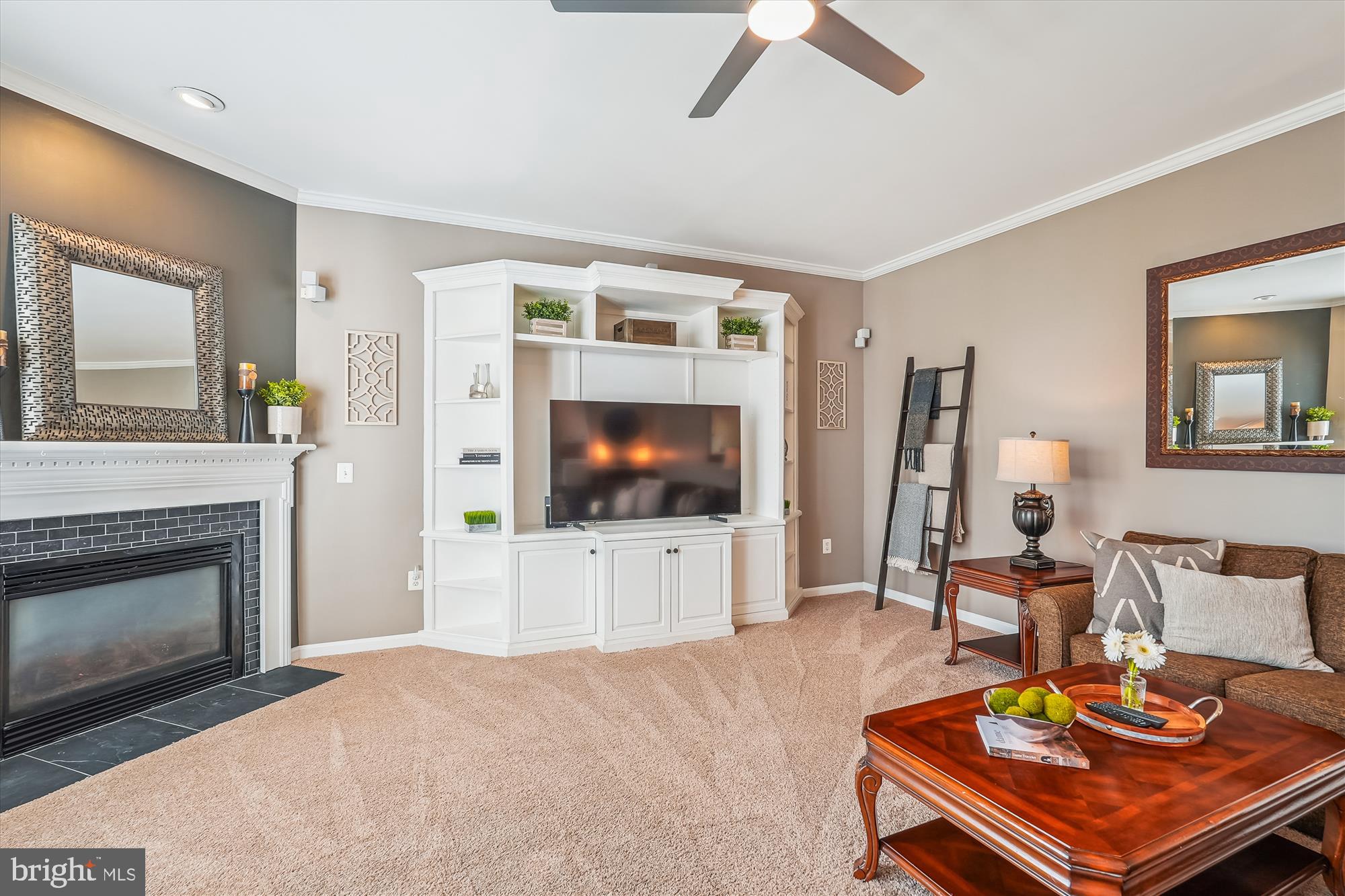 42925 Ellzey Drive Broadlands, VA 20148 - Photo 32 of 96 a living room with furniture and a flat screen tv