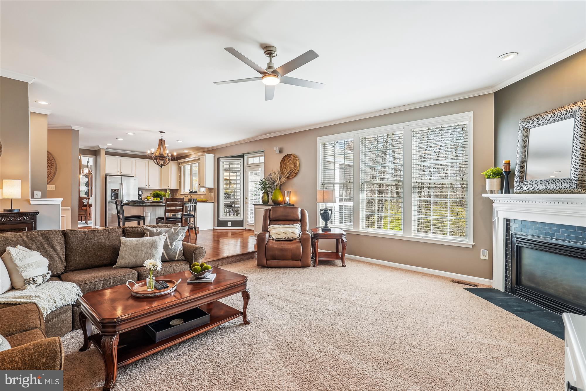 42925 Ellzey Drive Broadlands, VA 20148 - Photo 34 of 96 a living room with furniture and a fireplace