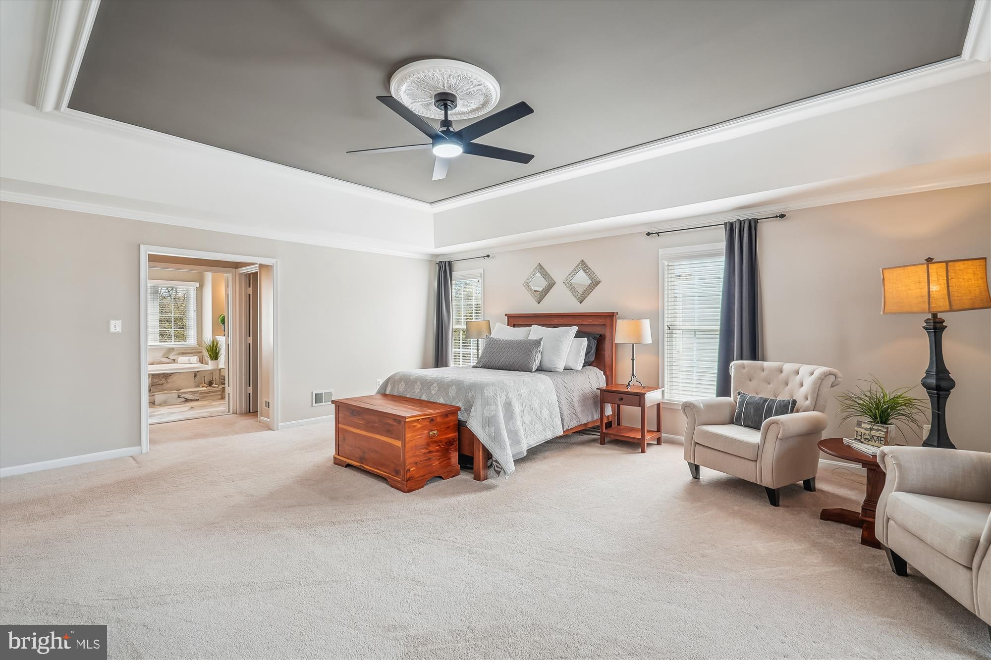 42925 Ellzey Drive Broadlands, VA 20148 - Photo 49 of 96 a bedroom with a bed couch chandelier and a window