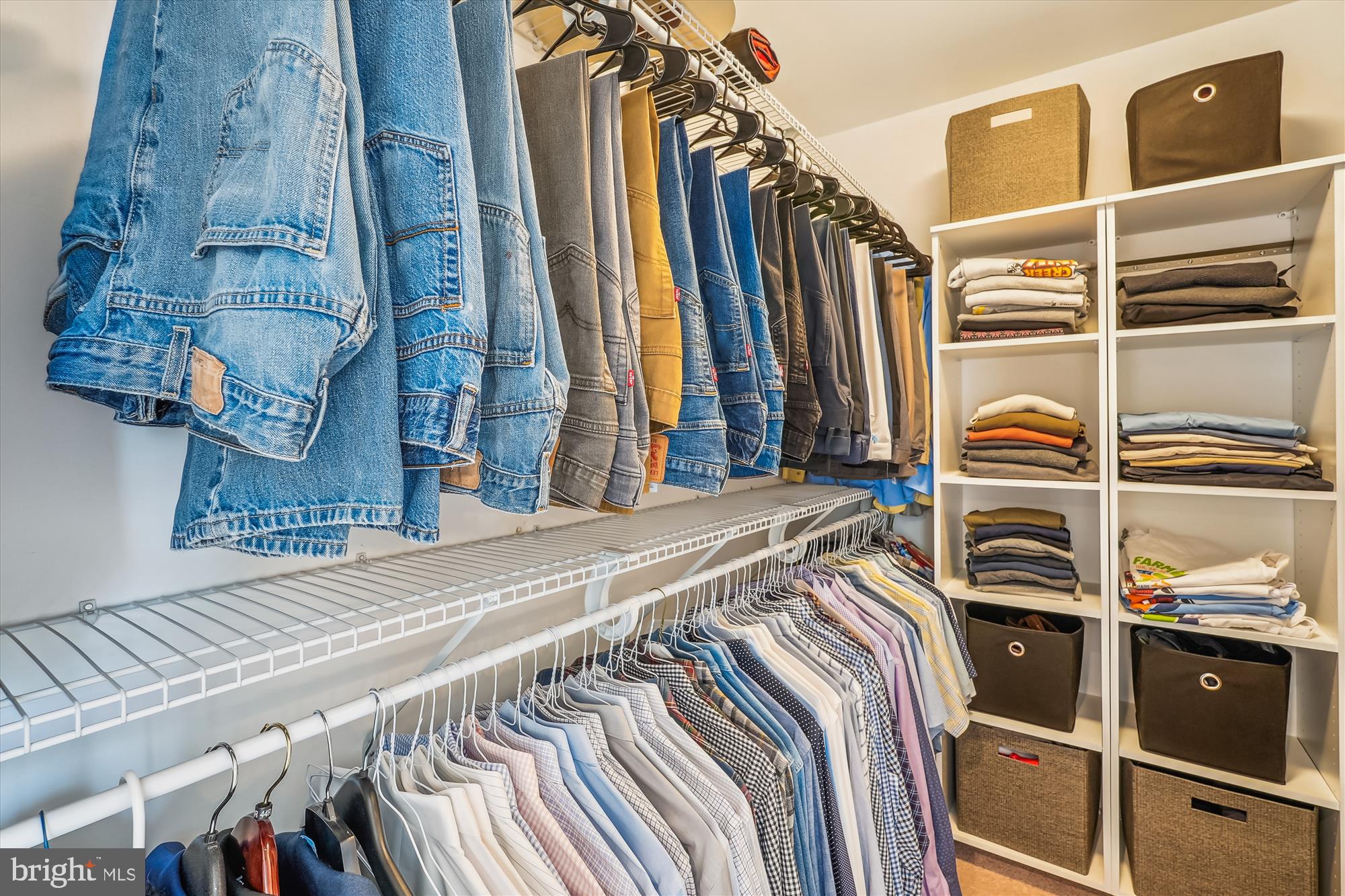42925 Ellzey Drive Broadlands, VA 20148 - Photo 55 of 96 a view of walk in closet with clothes and shoes