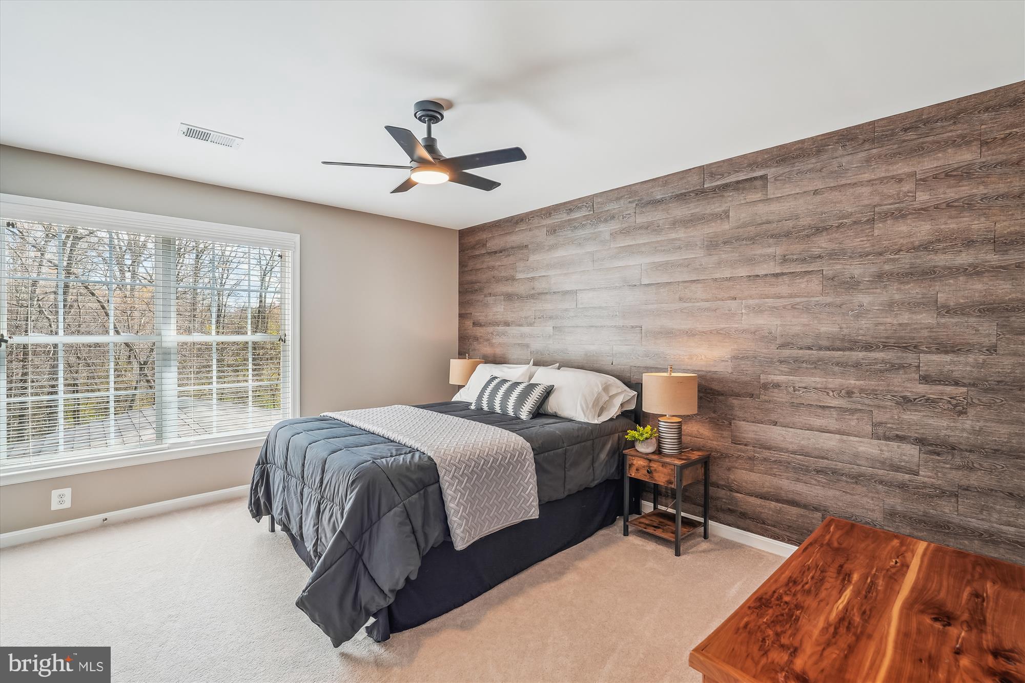 42925 Ellzey Drive Broadlands, VA 20148 - Photo 56 of 96 a bedroom with a bed and a ceiling fan