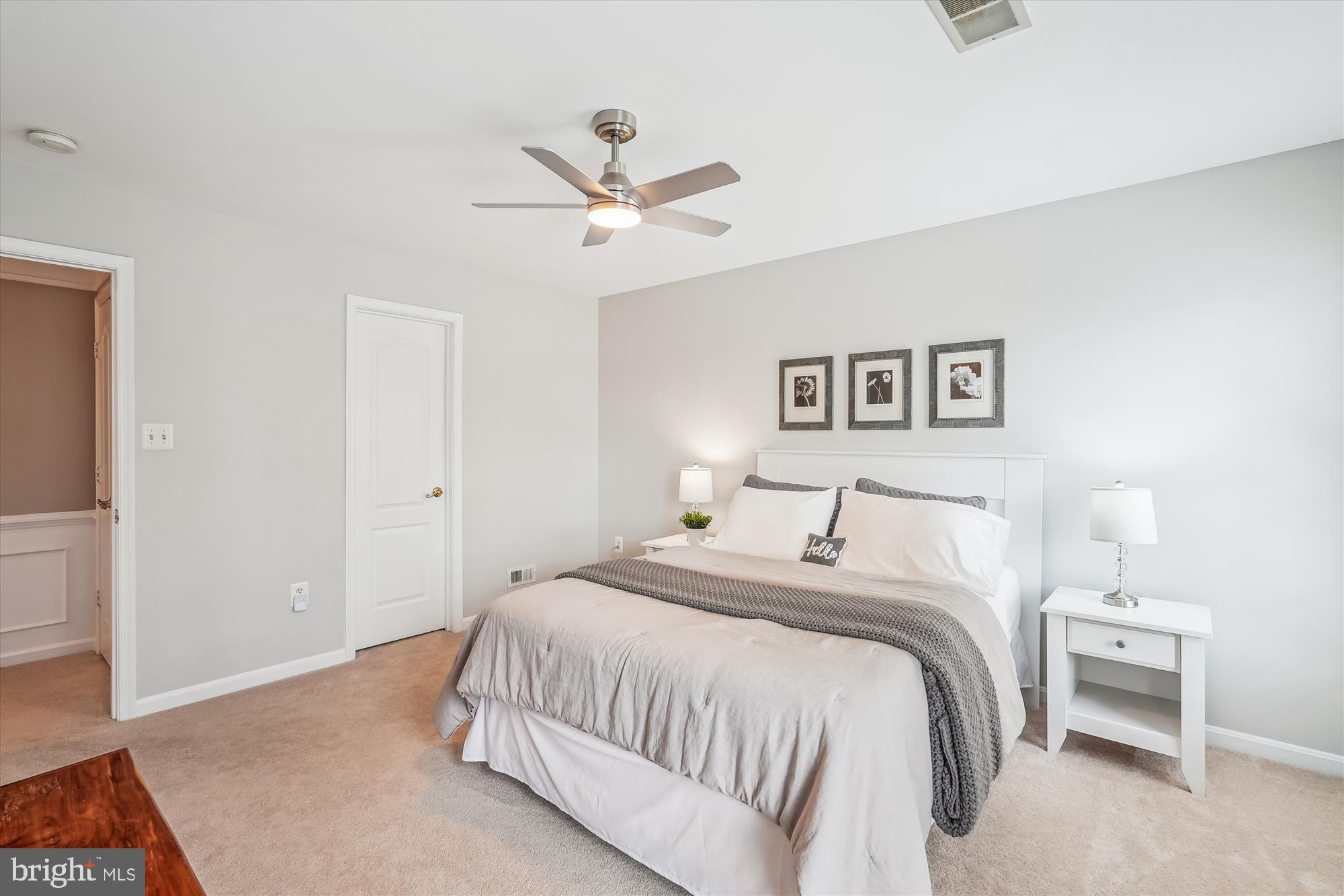 42925 Ellzey Drive Broadlands, VA 20148 - Photo 59 of 96 a bedroom with a bed and a painting on the wall