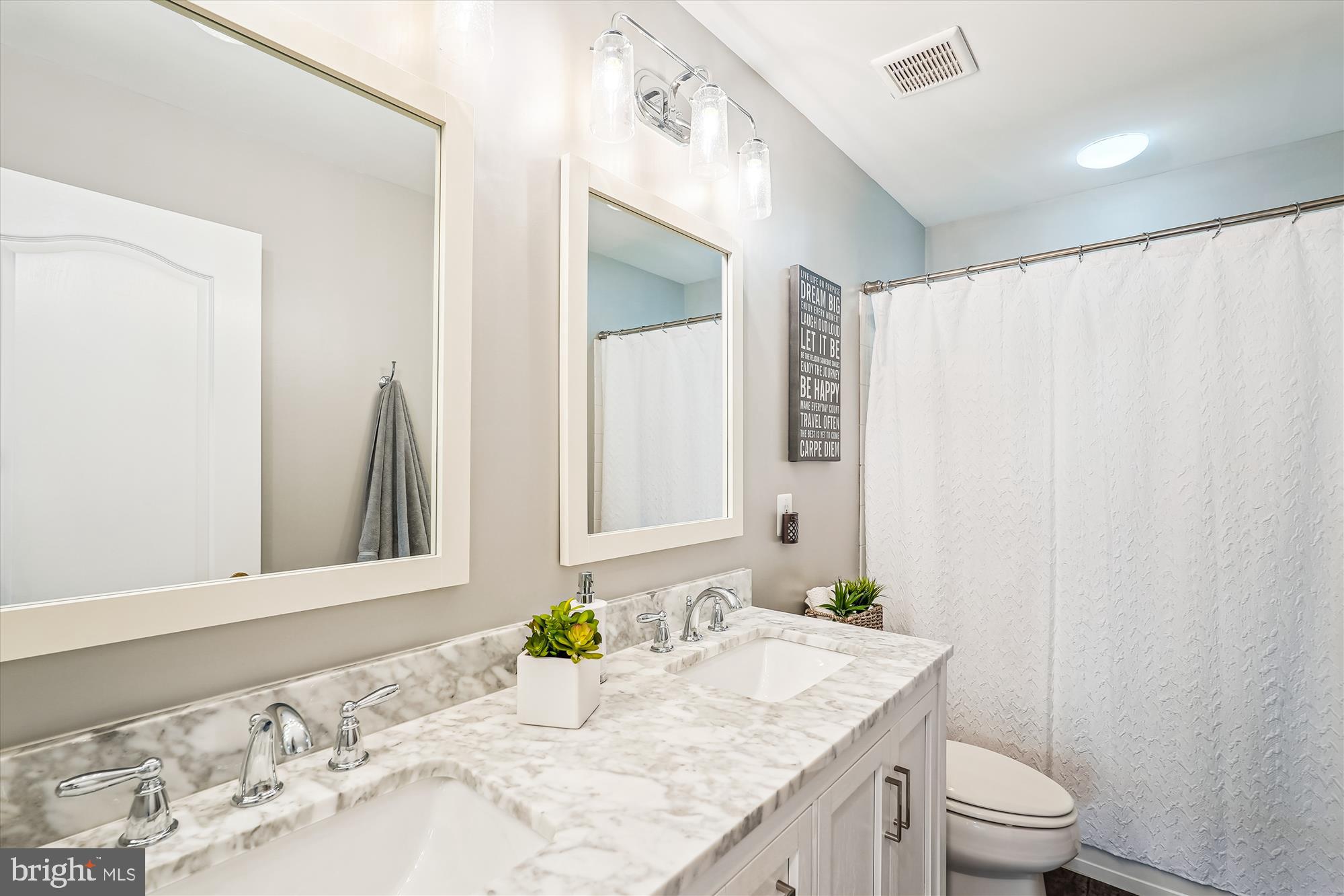 42925 Ellzey Drive Broadlands, VA 20148 - Photo 60 of 96 a bathroom with a granite countertop sink and a mirror