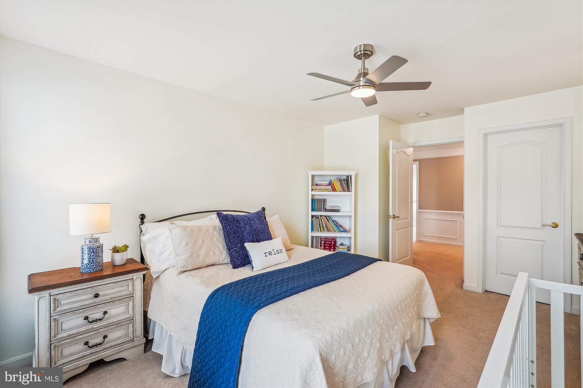 42925 Ellzey Drive Broadlands, VA 20148 - Photo 63 of 96 a bedroom with a bed and a chandelier