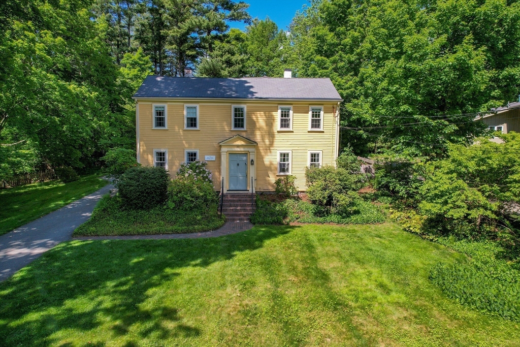 33 Grove Street Framingham, MA 01701 - Photo 29 of 33 a front view of a house with a yard