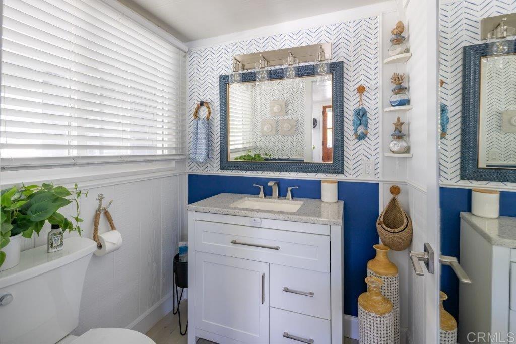 123 Jasper Street Encinitas, CA 92024 - Photo 11 of 15 a bathroom with a sink a toilet and a window