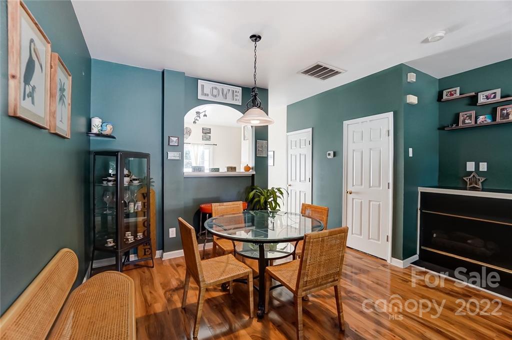 772 Shellstone Place Fort Mill, SC 29708 - Photo 12 of 35 a dining room with furniture and wooden floor