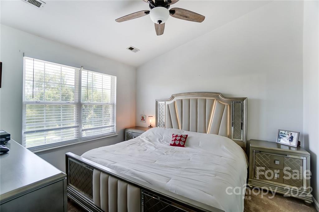 772 Shellstone Place Fort Mill, SC 29708 - Photo 18 of 35 a bedroom with a bed and a window