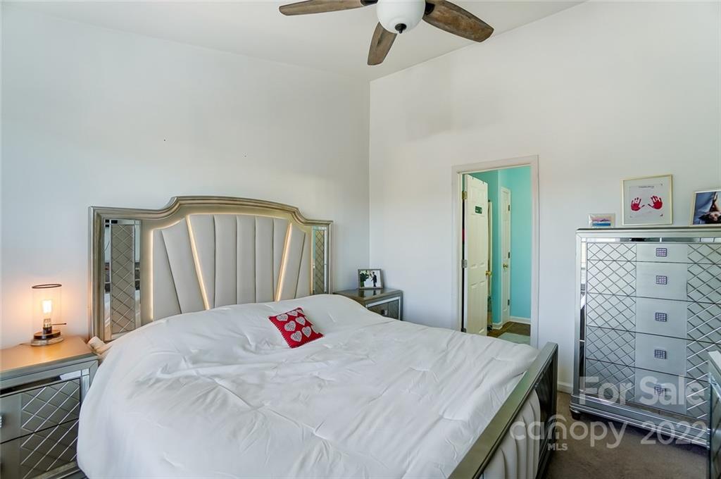 772 Shellstone Place Fort Mill, SC 29708 - Photo 19 of 35 a bedroom with a bed and a dresser