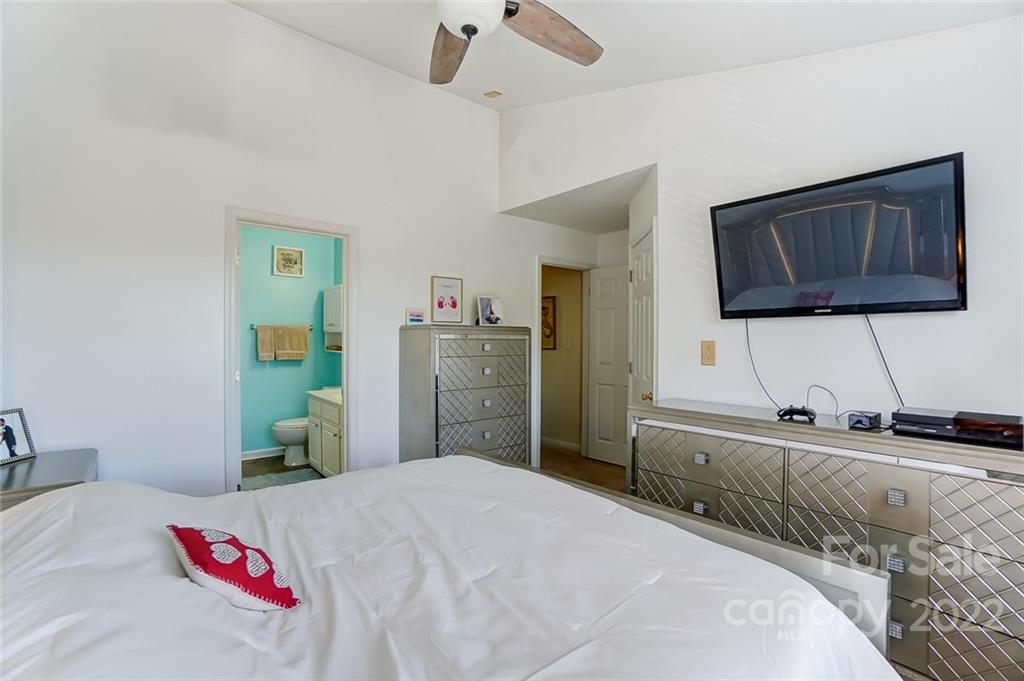 772 Shellstone Place Fort Mill, SC 29708 - Photo 20 of 35 a bedroom with a bed and a flat screen tv