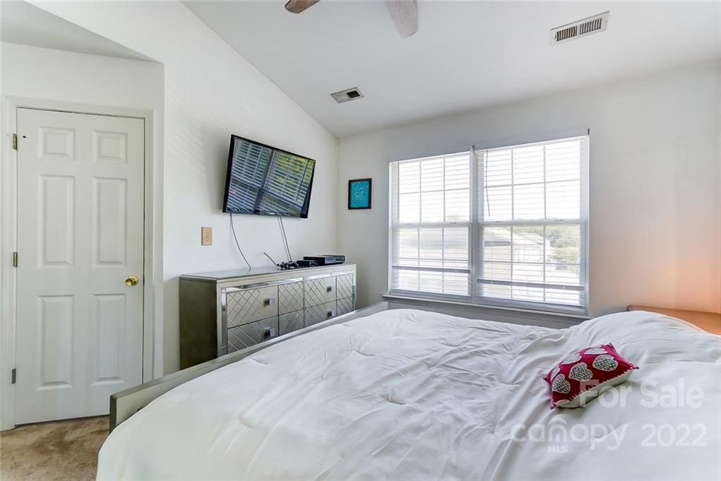 772 Shellstone Place Fort Mill, SC 29708 - Photo 21 of 35 a bedroom with a bed and a flat screen tv