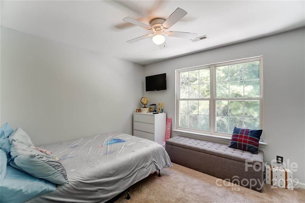 772 Shellstone Place Fort Mill, SC 29708 - Photo 23 of 35 a bedroom with a bed and a large window with the outer view