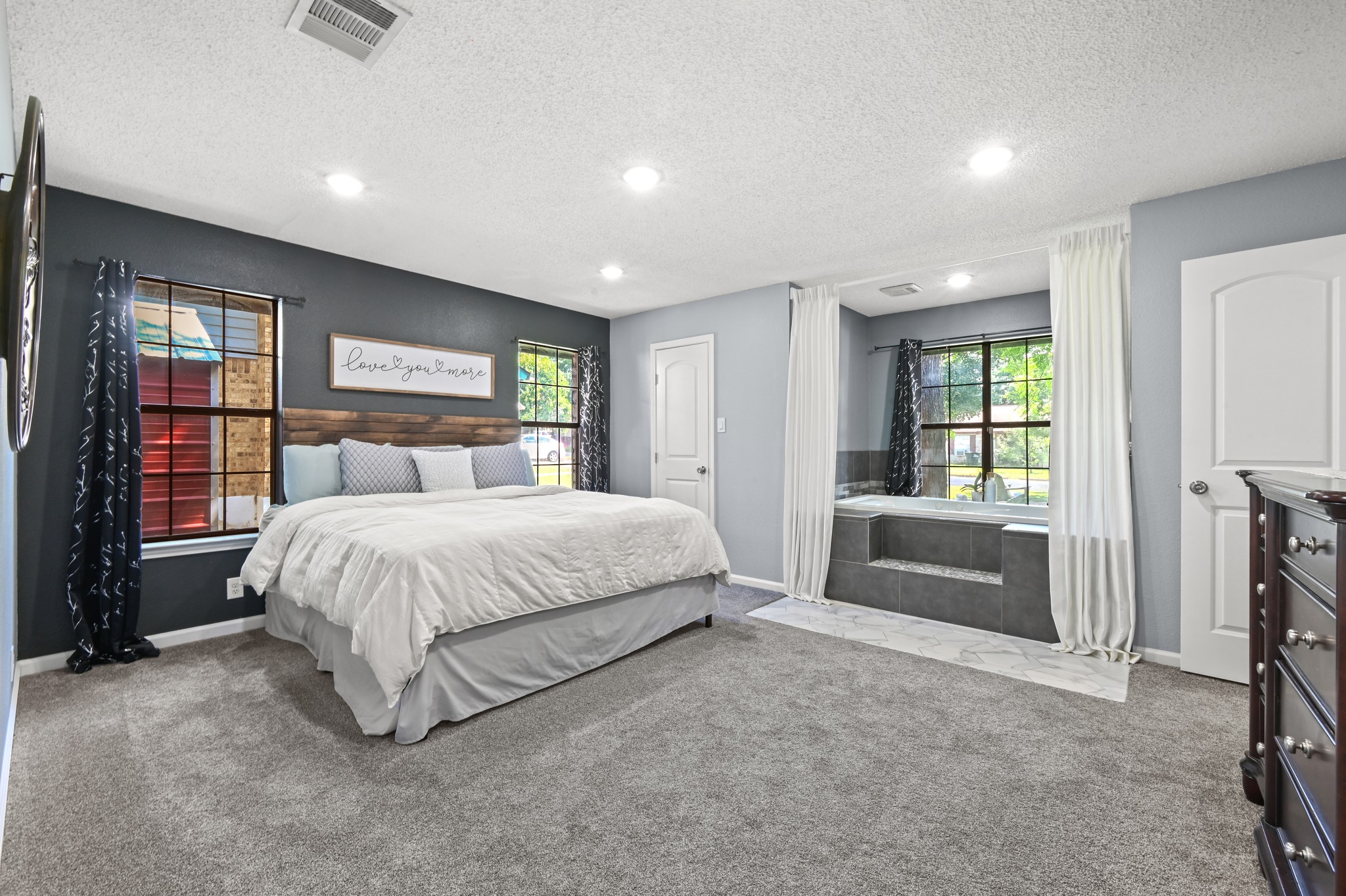 303 Pin Oak Drive Georgetown, TX 78628 - Photo 19 of 36 a bedroom with a large bed and a window