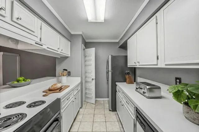 a kitchen with a sink stove and refrigerator